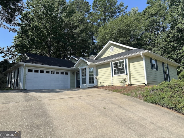 539 Horseshoe Cir, Stockbridge, GA 30281 - ranch-style house featuring concrete driveway and a garage