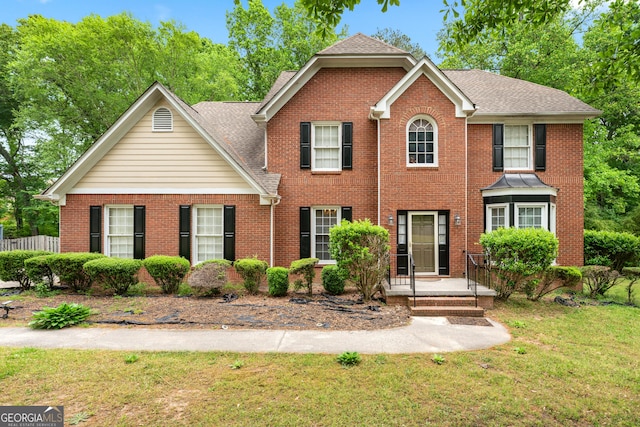 10044 Point View Dr, Jonesboro, GA 30238 - view of front of home featuring a front yard, brick siding, and a shingled roof