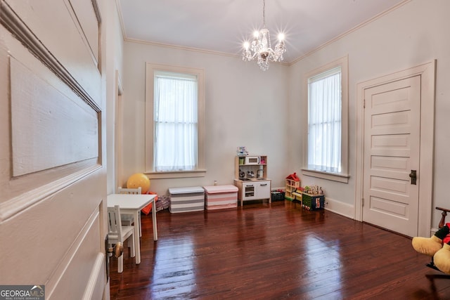 365 Seavy St, Senoia, GA 30276 - sitting room with healthy amount of natural light, a chandelier, crown molding, and wood-type flooring