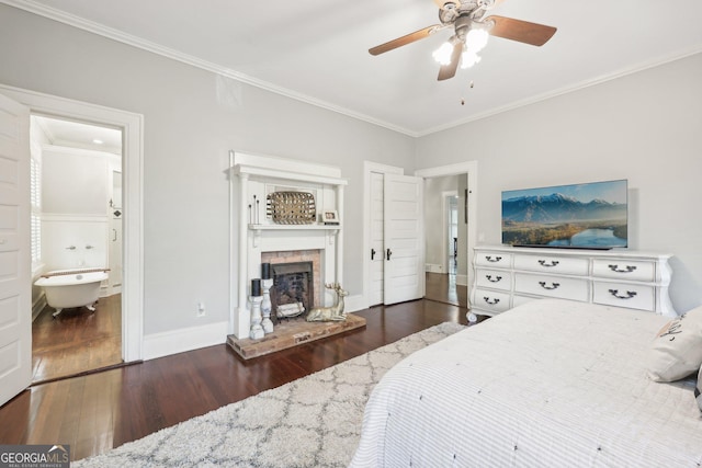 365 Seavy St, Senoia, GA 30276 - bedroom with a fireplace, crown molding, wood finished floors, a ceiling fan, and connected bathroom