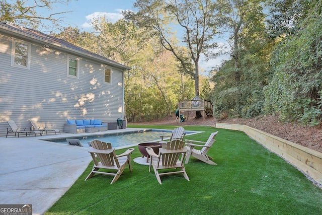 365 Seavy St, Senoia, GA 30276 - view of green lawn featuring a wooden deck, a patio area, and an outdoor pool