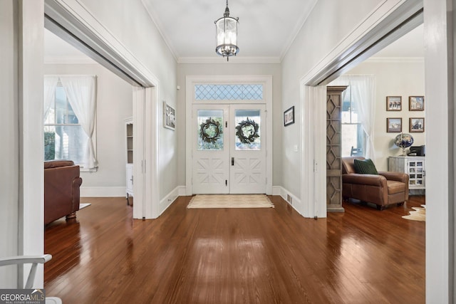 365 Seavy St, Senoia, GA 30276 - entryway with wood finished floors, crown molding, healthy amount of natural light, and a chandelier