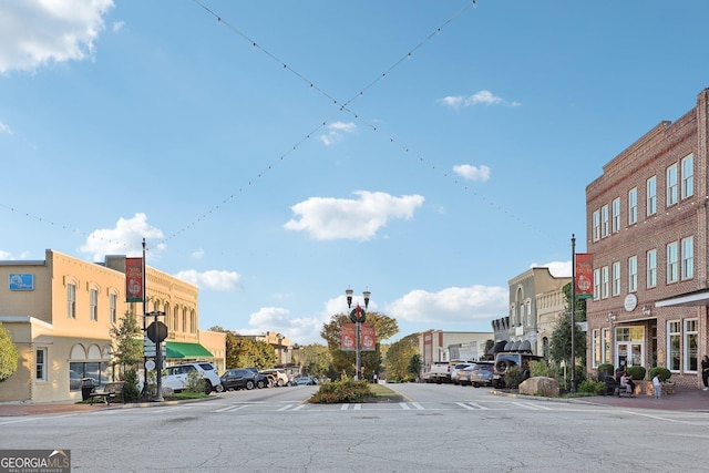 365 Seavy St, Senoia, GA 30276 - view of asphalt street with street lights, sidewalks, traffic signs, and curbs