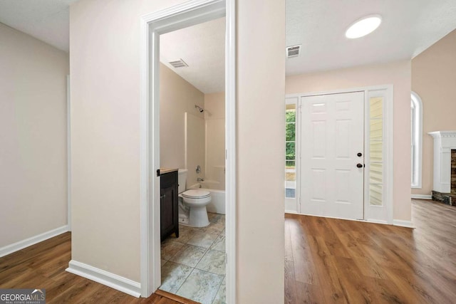 20 Four Oaks, Newnan, GA 30263 - entryway featuring wood finished floors and a fireplace