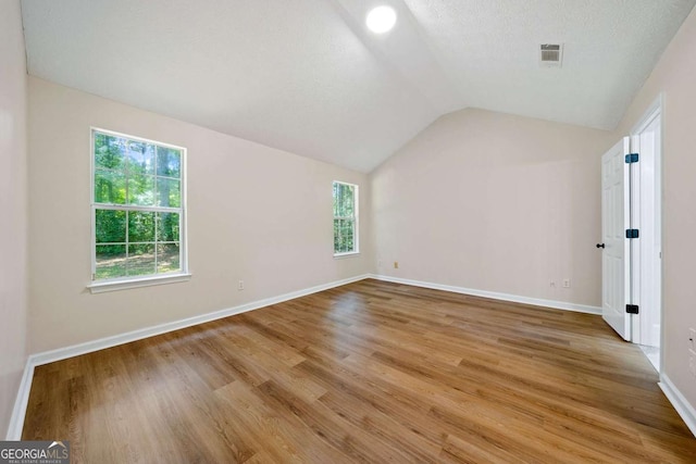 20 Four Oaks, Newnan, GA 30263 - additional living space featuring vaulted ceiling and light wood finished floors