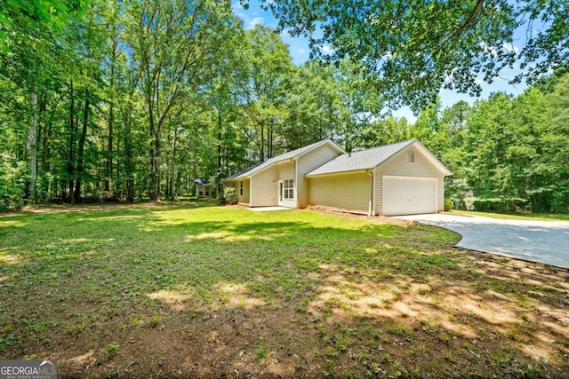 20 Four Oaks, Newnan, GA 30263 - view of front of house with concrete driveway, a garage, and a front yard