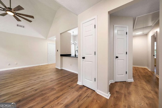 20 Four Oaks, Newnan, GA 30263 - corridor featuring attic access, wood finished floors, and vaulted ceiling