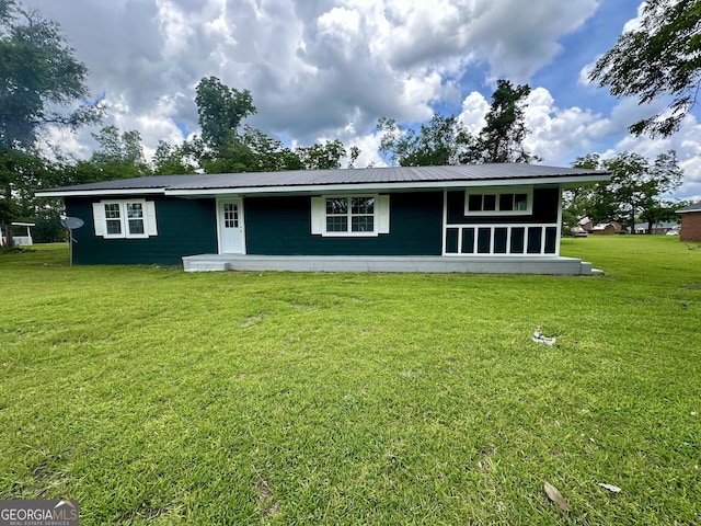 210 W Graham St, Mcrae-Helena, GA 31055 - view of front of house with a front yard and a metal roof