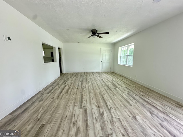 210 W Graham St, Mcrae-Helena, GA 31055 - spare room featuring light wood-style floors, a ceiling fan, and a textured ceiling