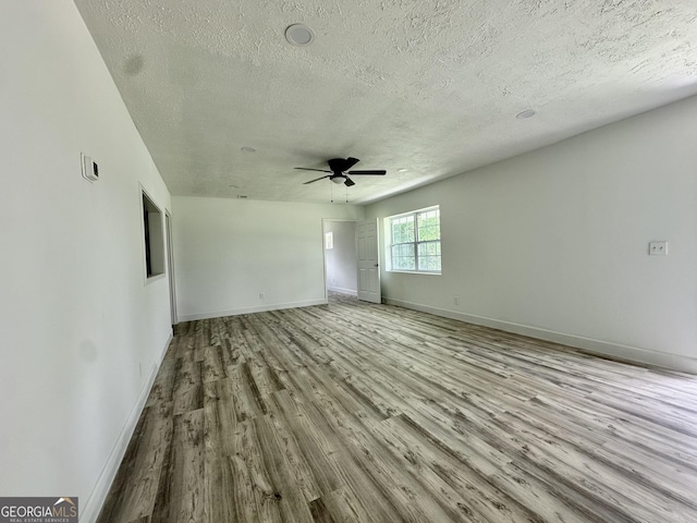 210 W Graham St, Mcrae-Helena, GA 31055 - unfurnished room featuring a textured ceiling, wood finished floors, and ceiling fan