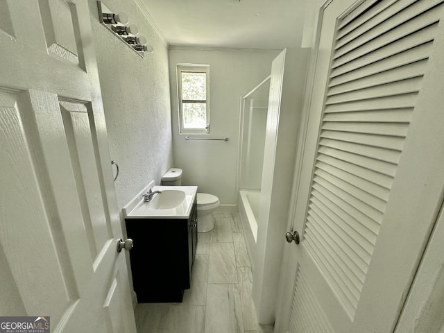210 W Graham St, Mcrae-Helena, GA 31055 - full bathroom featuring vanity, a textured wall, bathing tub / shower combination, ornamental molding, and marble look tile flooring