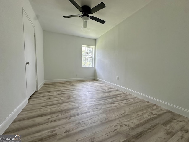 210 W Graham St, Mcrae-Helena, GA 31055 - unfurnished bedroom with wood finished floors and a ceiling fan