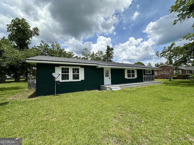 210 W Graham St, Mcrae-Helena, GA 31055 - view of front of home featuring a front yard and a metal roof