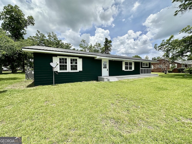 210 W Graham St, Mcrae-Helena, GA 31055 - view of front of house featuring a front lawn and a metal roof