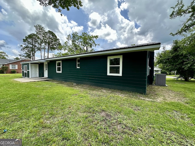 210 W Graham St, Mcrae-Helena, GA 31055 - rear view of house featuring a lawn and a patio
