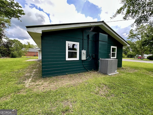 210 W Graham St, Mcrae-Helena, GA 31055 - view of side of home featuring a central air condition unit and a yard