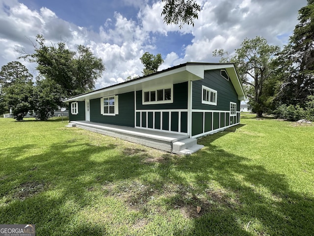 210 W Graham St, Mcrae-Helena, GA 31055 - view of side of property with a yard