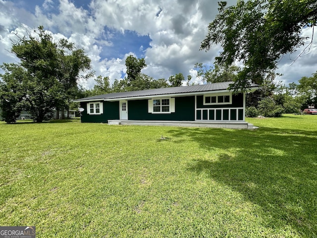 210 W Graham St, Mcrae-Helena, GA 31055 - view of front of home featuring a front lawn and a metal roof