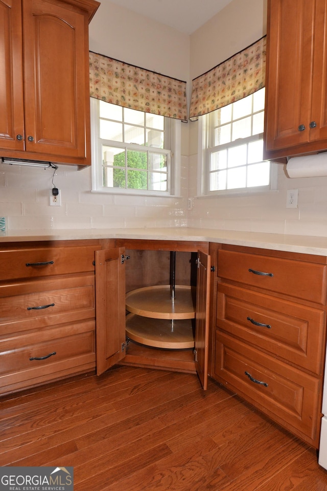 195 Twin Oaks Dr, Hampton, GA 30228 - kitchen featuring decorative backsplash, light countertops, and brown cabinets