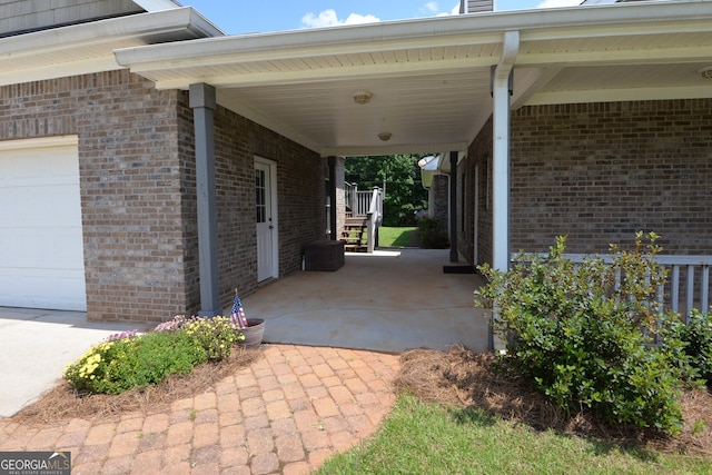 195 Twin Oaks Dr, Hampton, GA 30228 - view of patio with an attached garage