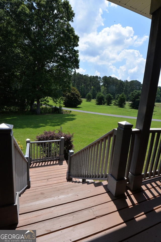 195 Twin Oaks Dr, Hampton, GA 30228 - wooden terrace featuring a lawn