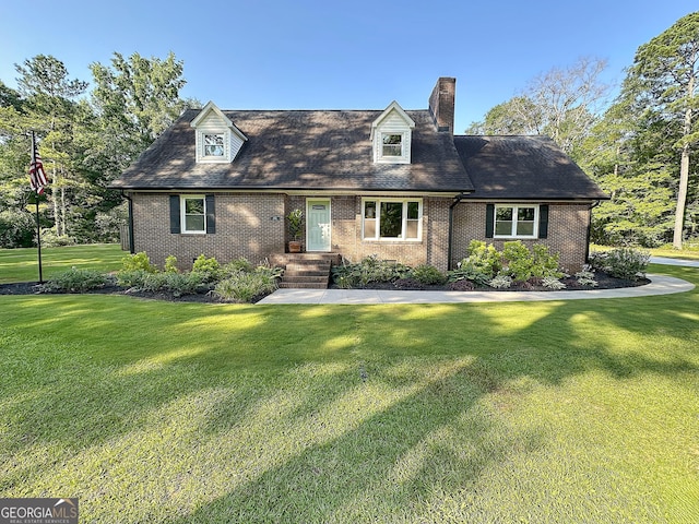 1501 E Main St, Hogansville, GA 30230 - new england style home featuring brick siding, a front lawn, and a chimney