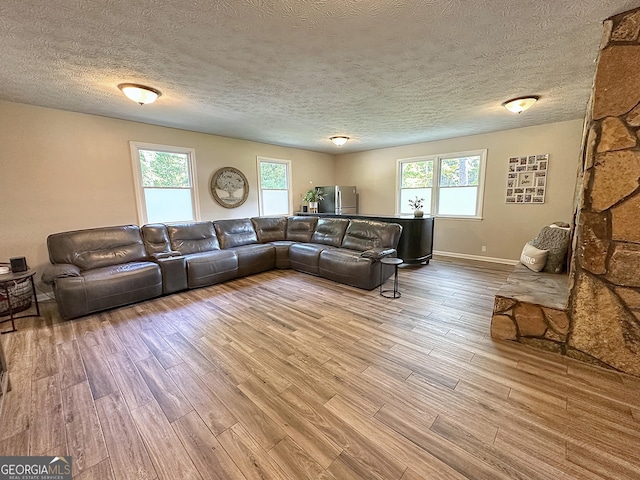 1501 E Main St, Hogansville, GA 30230 - living room featuring wood finished floors and a textured ceiling