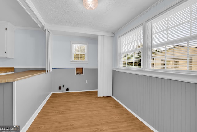 303 Oak Way Dr, Eastanollee, GA 30538 - laundry room with hookup for a washing machine, a textured ceiling, light wood-style flooring, gas dryer hookup, and wainscoting