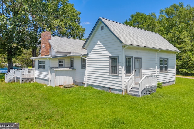 303 Oak Way Dr, Eastanollee, GA 30538 - view of home's exterior featuring a chimney, crawl space, roof with shingles, a yard, and a wooden deck