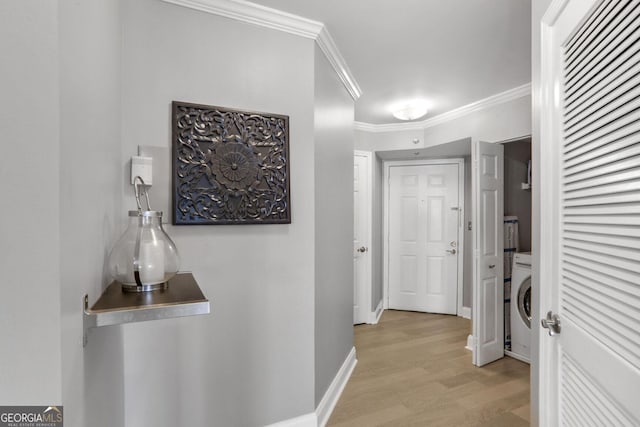 795 Hammond Dr Unit 1012, Atlanta, GA 30328 - hall featuring light wood finished floors, ornamental molding, and washer / clothes dryer