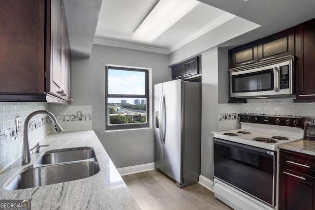 795 Hammond Dr Unit 1012, Atlanta, GA 30328 - kitchen featuring stainless steel appliances, ornamental molding, light wood-type flooring, backsplash, and light stone counters