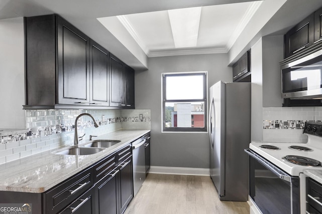 795 Hammond Dr Unit 1012, Atlanta, GA 30328 - kitchen featuring stainless steel appliances, light wood finished floors, ornamental molding, decorative backsplash, and light stone countertops