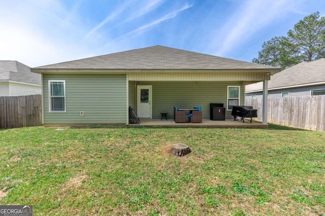 104 Hughes Dr, Warner Robins, GA 31093 - rear view of house featuring a patio area and a fenced backyard