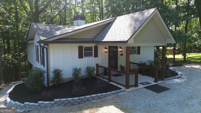 109 Windsong Way, Westminster, SC 29693 - view of front of house featuring board and batten siding, a chimney, and a shingled roof