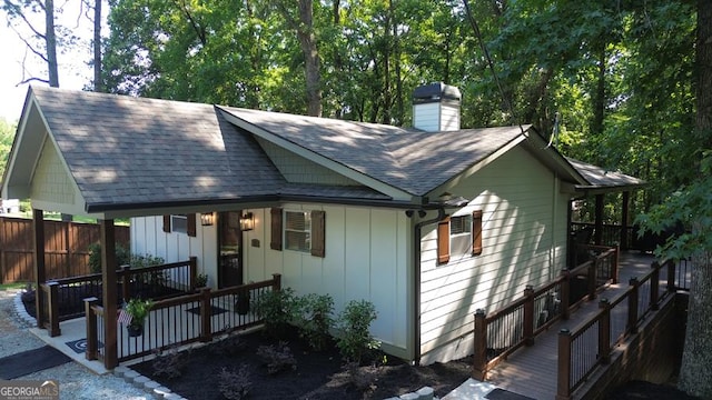 109 Windsong Way, Westminster, SC 29693 - view of front of home featuring a chimney, a wooden deck, board and batten siding, and a shingled roof