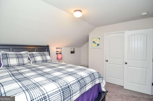 2436 Loughridge Dr, Buford, GA 30519 - bedroom with carpet flooring, vaulted ceiling, and a closet