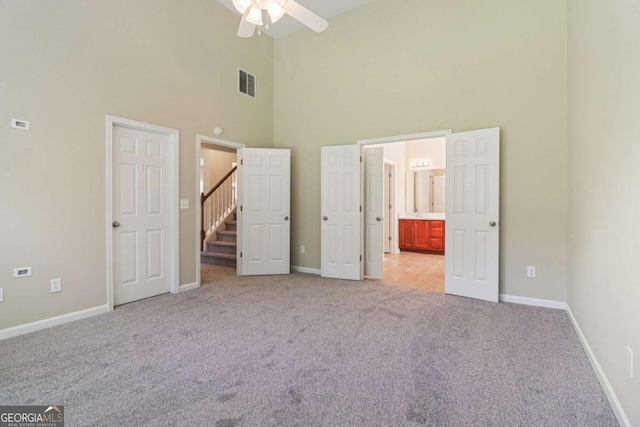1755 Rutland Pass Dr, Lawrenceville, GA 30045 - unfurnished bedroom with high vaulted ceiling, light colored carpet, and ensuite bath