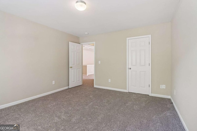 1755 Rutland Pass Dr, Lawrenceville, GA 30045 - unfurnished bedroom with carpet floors and baseboards