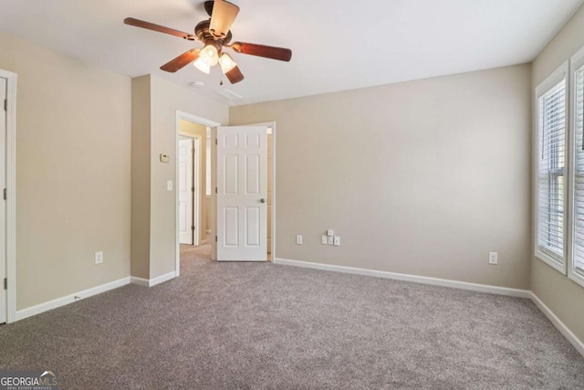 1755 Rutland Pass Dr, Lawrenceville, GA 30045 - unfurnished bedroom with carpet flooring, multiple windows, and ceiling fan
