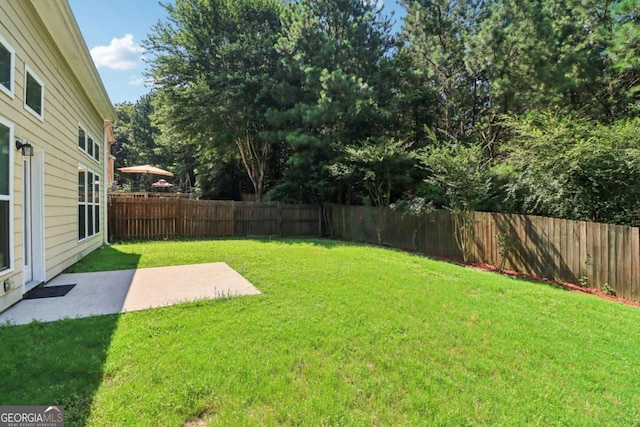 1755 Rutland Pass Dr, Lawrenceville, GA 30045 - fenced backyard featuring a patio area