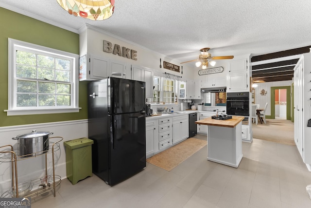 2540 Sugar Hill Rd, Unadilla, GA 31091 - kitchen featuring black appliances, wood counters, a textured ceiling, healthy amount of natural light, and a ceiling fan
