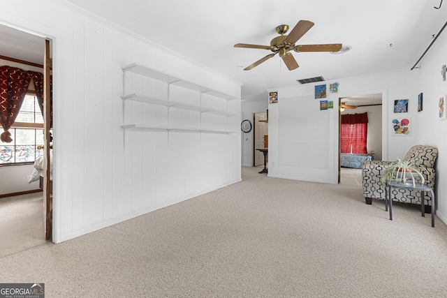 2540 Sugar Hill Rd, Unadilla, GA 31091 - living area with ceiling fan, carpet flooring, and ornamental molding