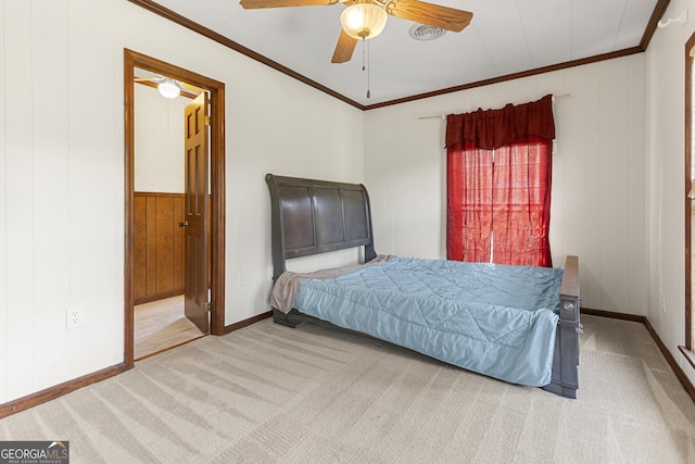 2540 Sugar Hill Rd, Unadilla, GA 31091 - bedroom with carpet, crown molding, a ceiling fan, wooden walls, and ensuite bathroom