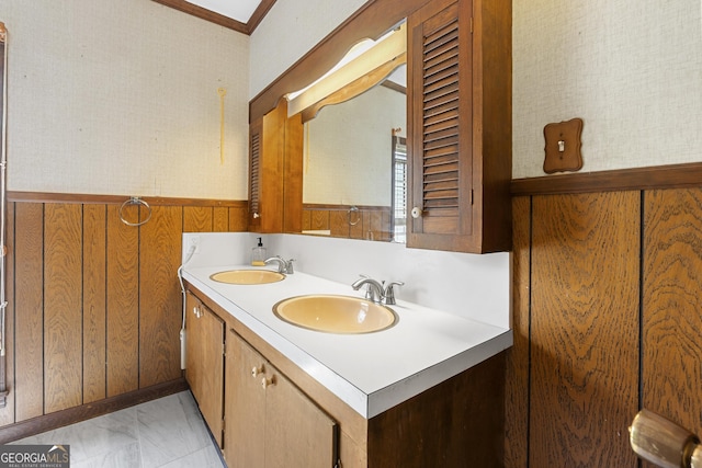 2540 Sugar Hill Rd, Unadilla, GA 31091 - bathroom with double vanity, marble finish flooring, wainscoting, wood walls, and ornamental molding