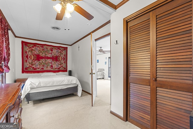 2540 Sugar Hill Rd, Unadilla, GA 31091 - bedroom with crown molding, light carpet, a closet, and a ceiling fan