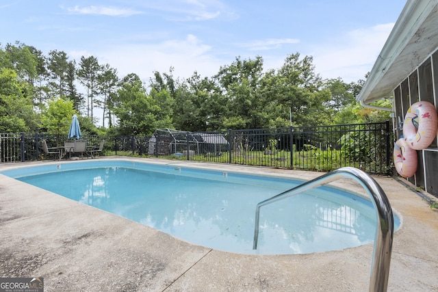 2540 Sugar Hill Rd, Unadilla, GA 31091 - view of swimming pool with a fenced backyard and view of wooded area