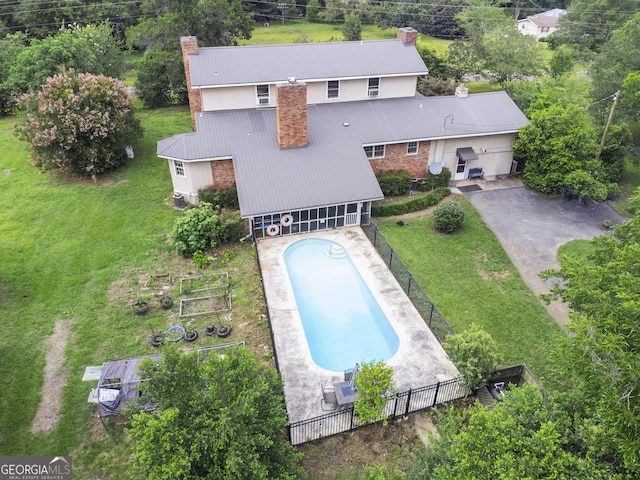 2540 Sugar Hill Rd, Unadilla, GA 31091 - rear view of house featuring a chimney, concrete driveway, and a metal roof