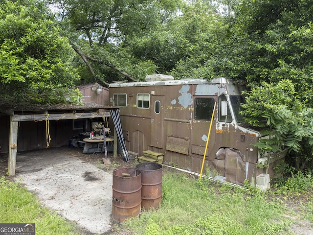 2540 Sugar Hill Rd, Unadilla, GA 31091 - rear view of property with an outbuilding