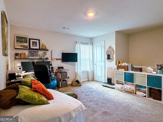 534 Meadows Farm Dr, Monroe, GA 30655 - bedroom with a textured ceiling, carpet floors, and a desk