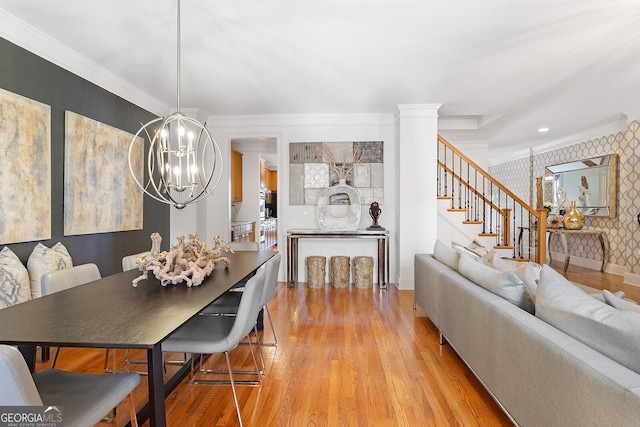 196 Mystic Ct, Atlanta, GA 30342 - dining room featuring a chandelier, stairway, wood finished floors, wallpapered walls, and ornamental molding